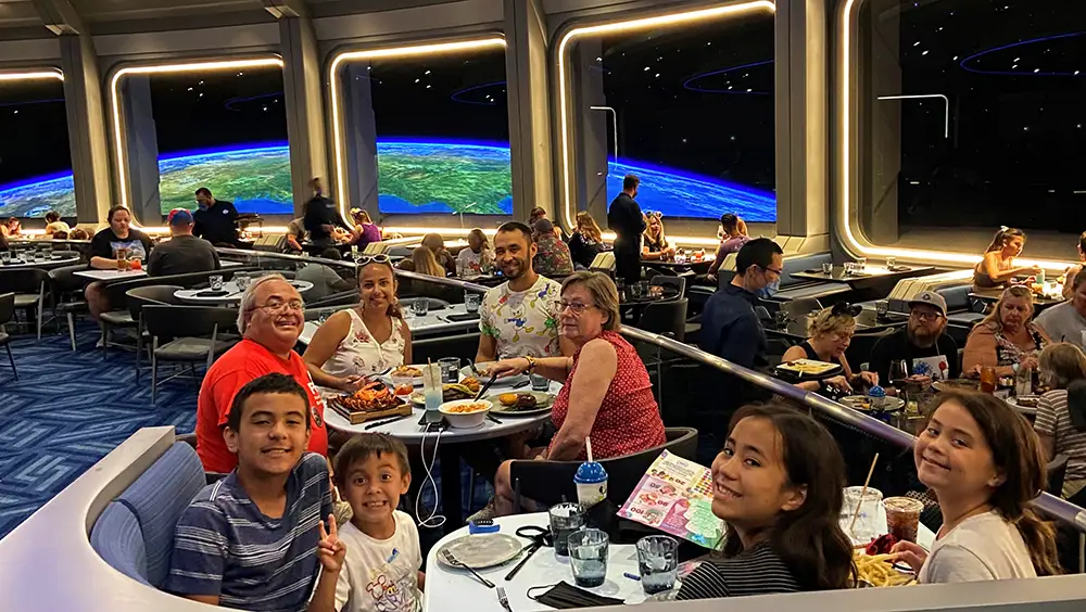 Family eating at Space 220 restaurant at Wat Disney World in Epcot.