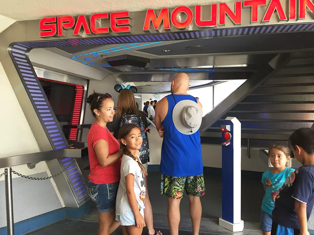 Standing in line at Space Mountain in Disneyland with the grandkids.